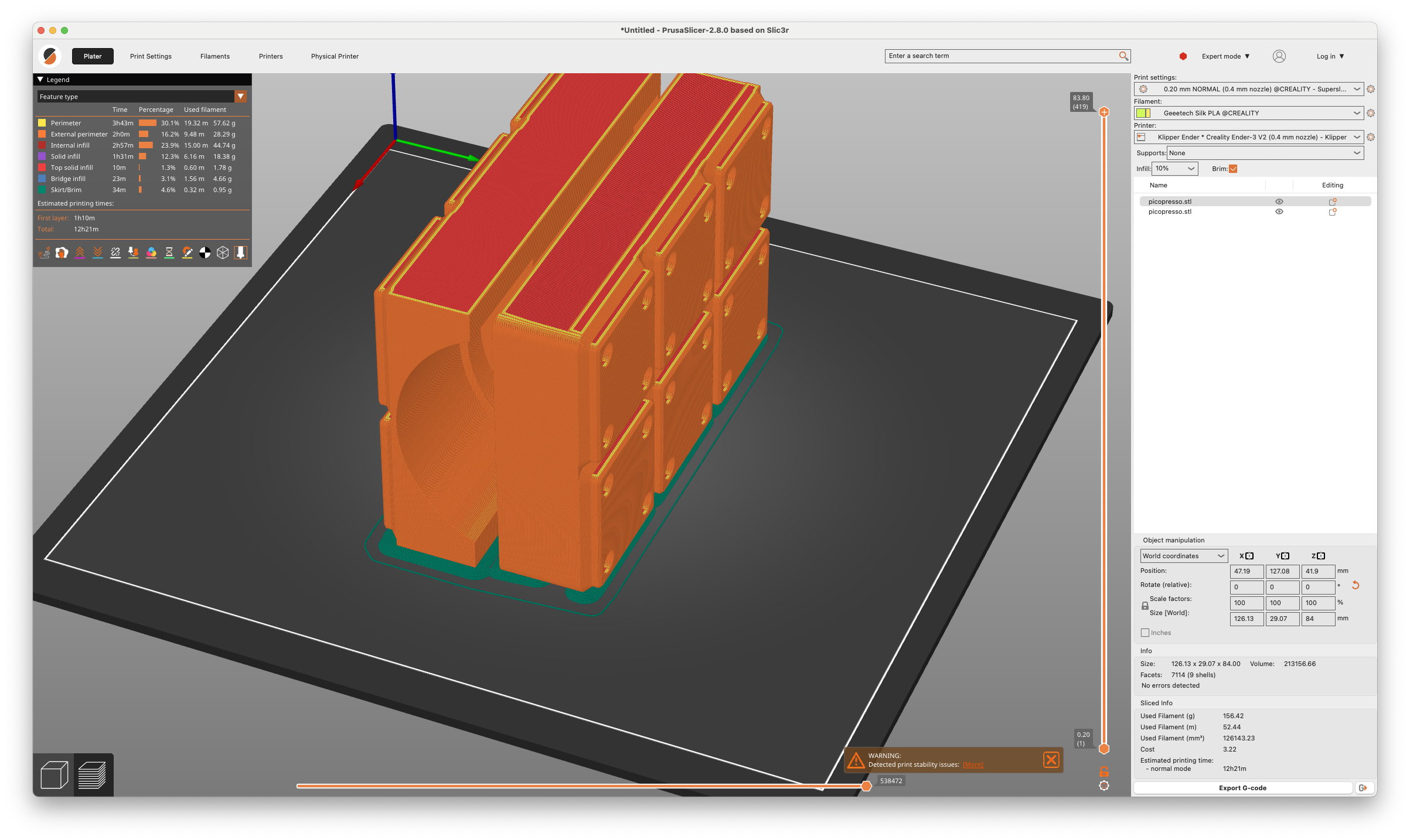 screenshot of PrusaSlicer program on macOS. It shows a model cut into two parts placed and sliced on the printbed.